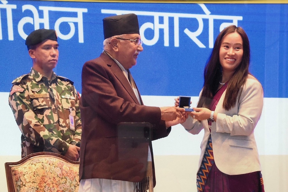 Ms. Sunita receiving CIP Award 2020 from PM KP Oli